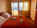 Appartamenti Paradiso with gorgeous sea view: A1 Doris (4+2), SA2 Petra (2+2), SA3 Nina (2) Lokva Rogoznica - Riviera Omis  - Appartamento - A1 Doris (4+2): la camera da letto